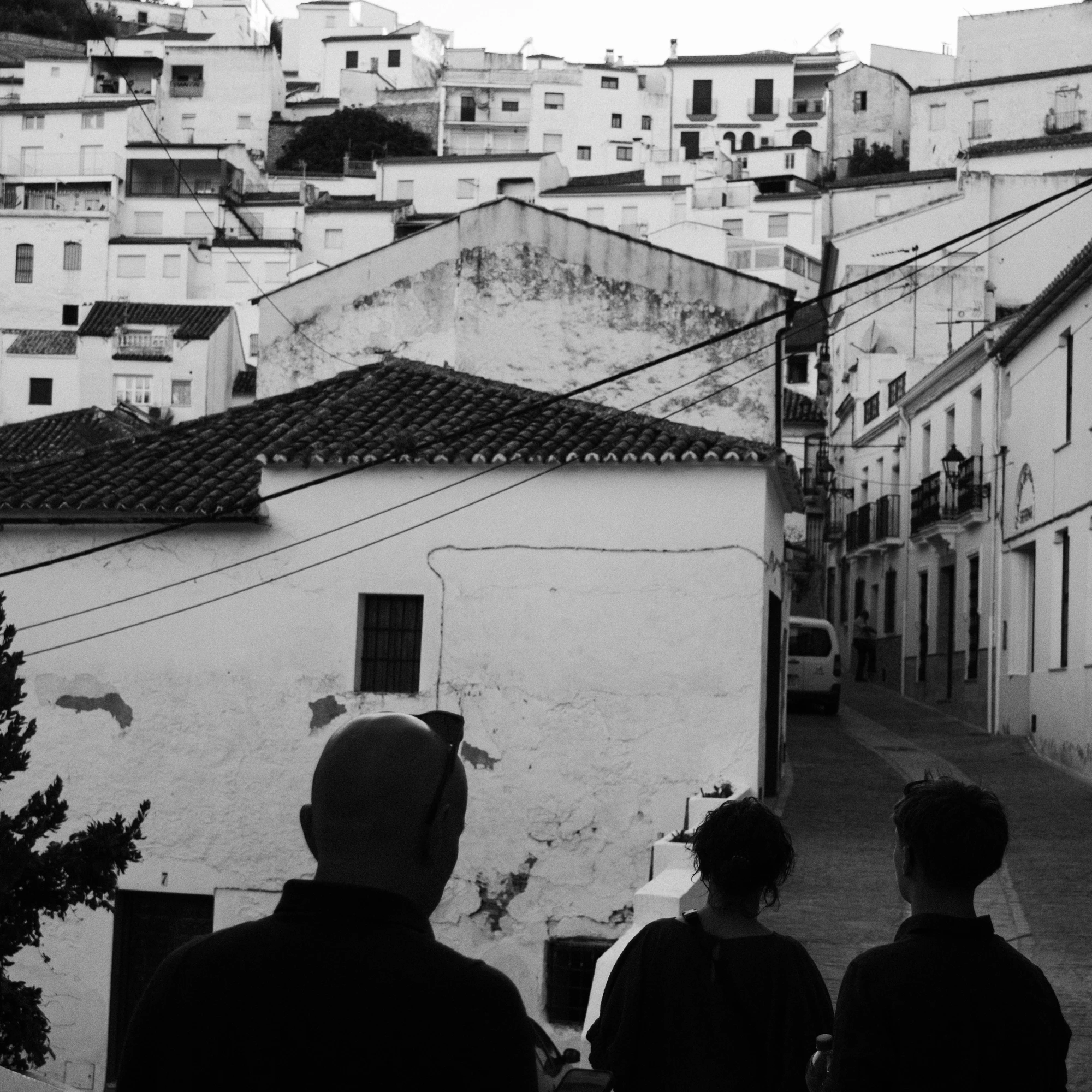 Pueblo blanco overlook with silhouettes, black and white